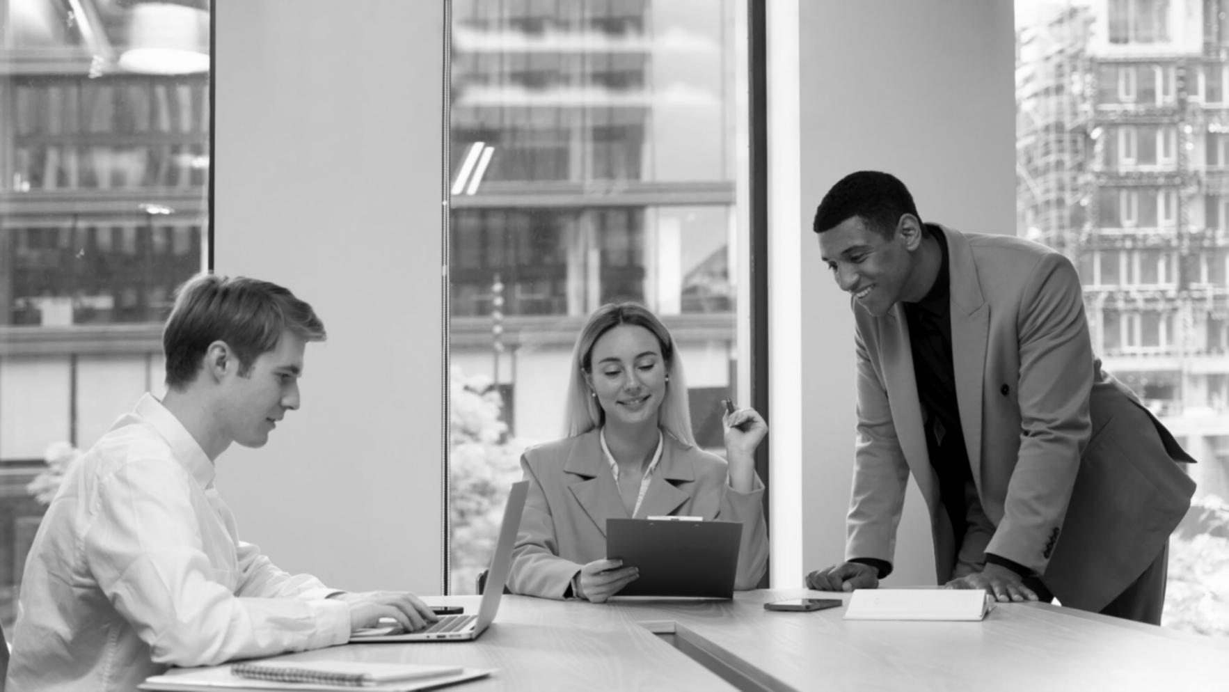 Students collaborating on motion graphics projects in modern studio environment