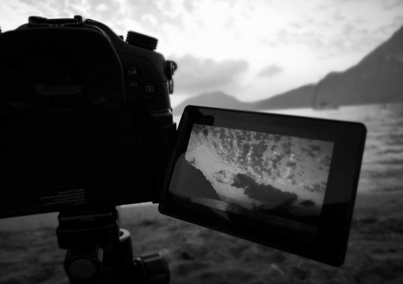 Motion graphics team collaborating on creative project with multiple screens and design tools